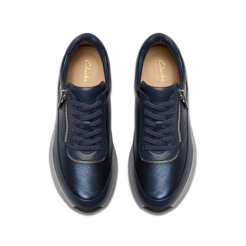 Navy leather sneakers with decorative zippers and laces.