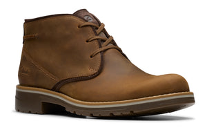 Brown leather chukka boot with lace-up closure and visible stitching.