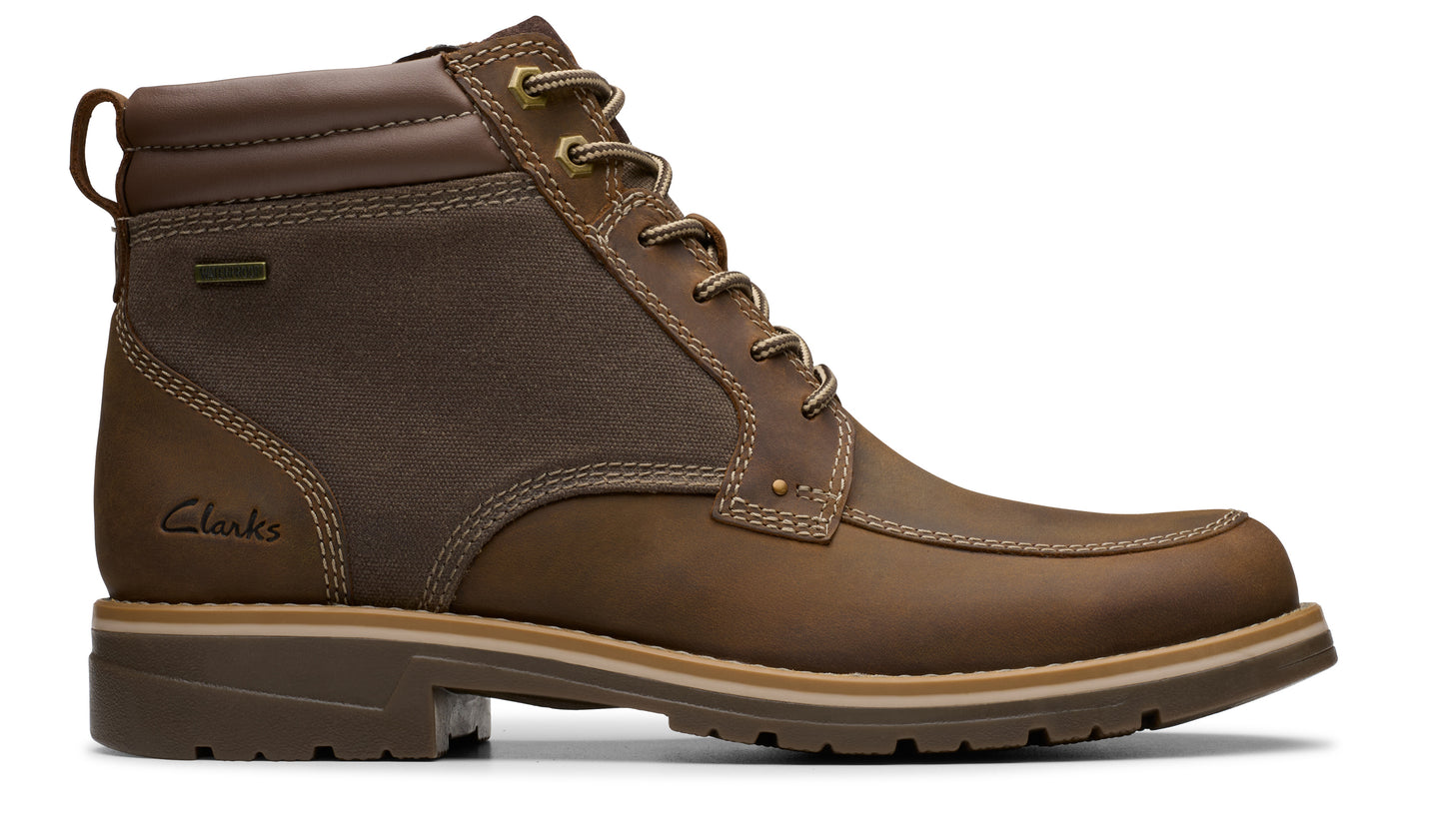 Brown leather ankle boot with laces and visible stitching details.
