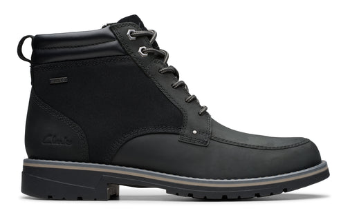 Black lace-up boot with a grey sole and a pull loop on the back