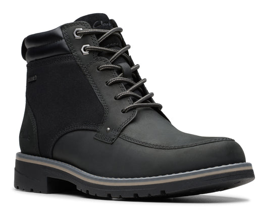 Black ankle boot with lace-up closure, metal eyelets, and textured sole.