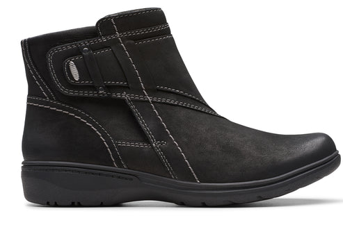 Black ankle boot with side zipper and decorative stitching.