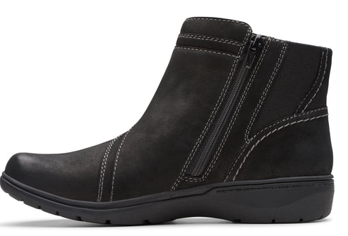 Black ankle boot with side zipper, round toe, and a low heel.