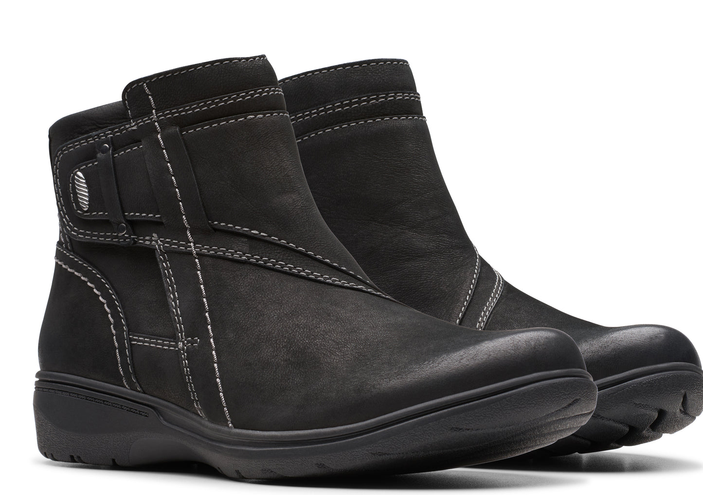 Pair of black ankle boots with decorative white stitching and side buckle.