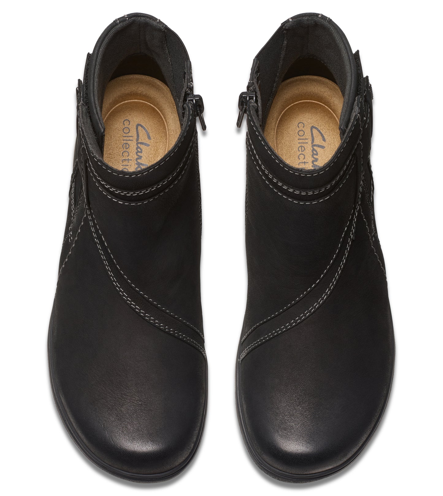 Pair of ankle boots, black leather, decorative stitching, side zipper, top-down view.