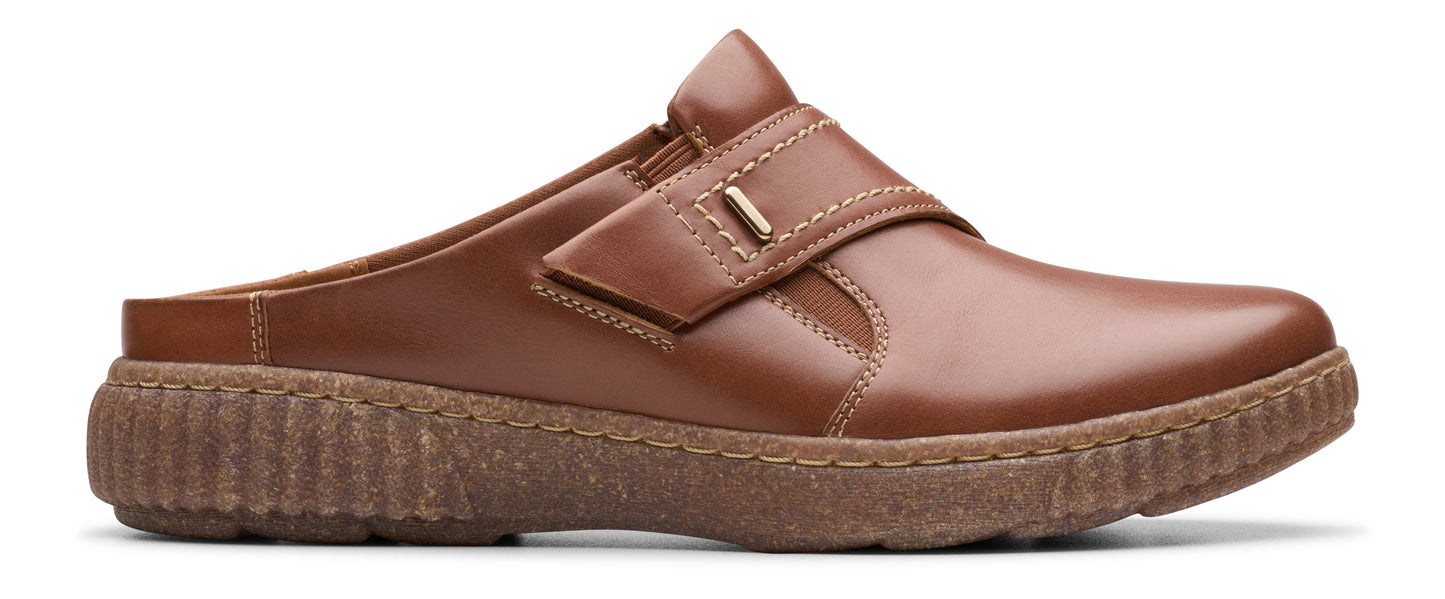 A brown leather slip-on shoe with a thick, ribbed sole.