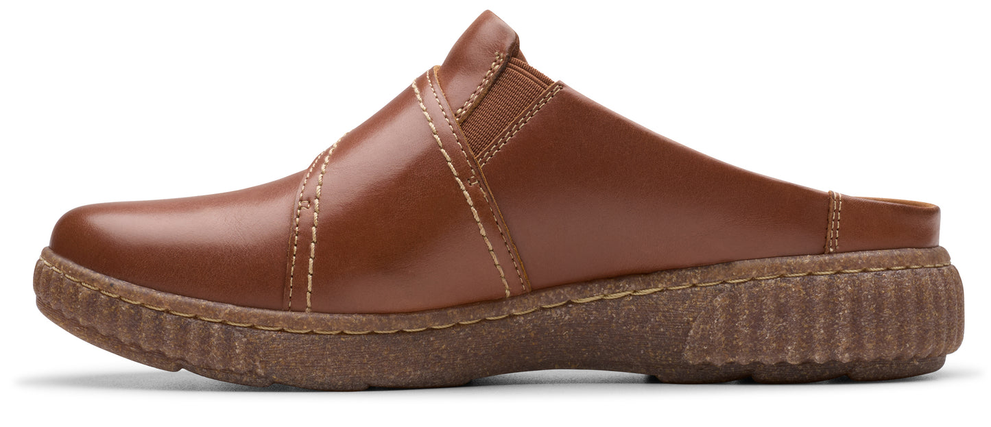 A brown leather clog with crosswise strap detail and ridged sole.