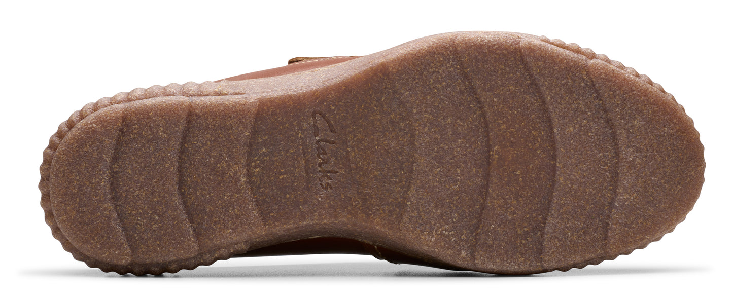 Brown shoe sole with a ridged pattern.