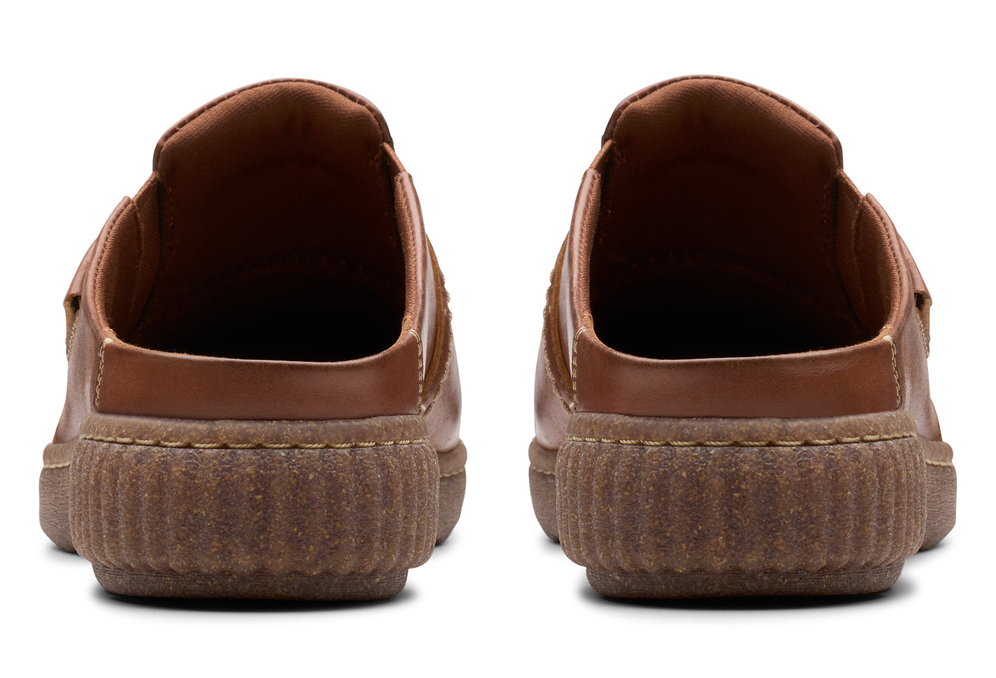 Pair of brown leather mules, viewed from the back.