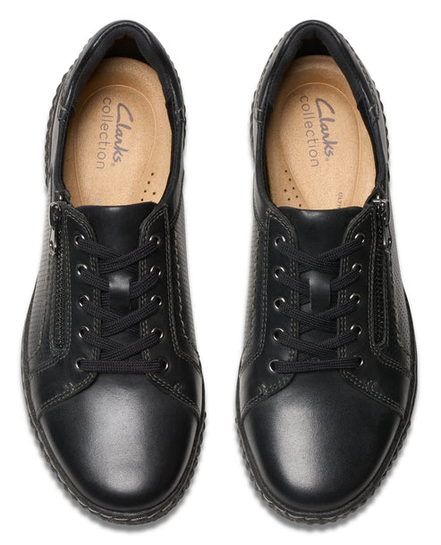 Pair of black leather low-rise sneakers with laces and side zipper.