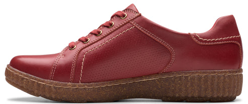 Red leather low-top shoe with a brown rubber sole.