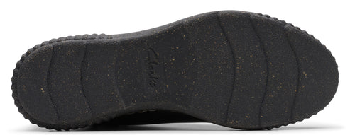 A close-up of a black shoe sole showing a textured, ridged pattern.
