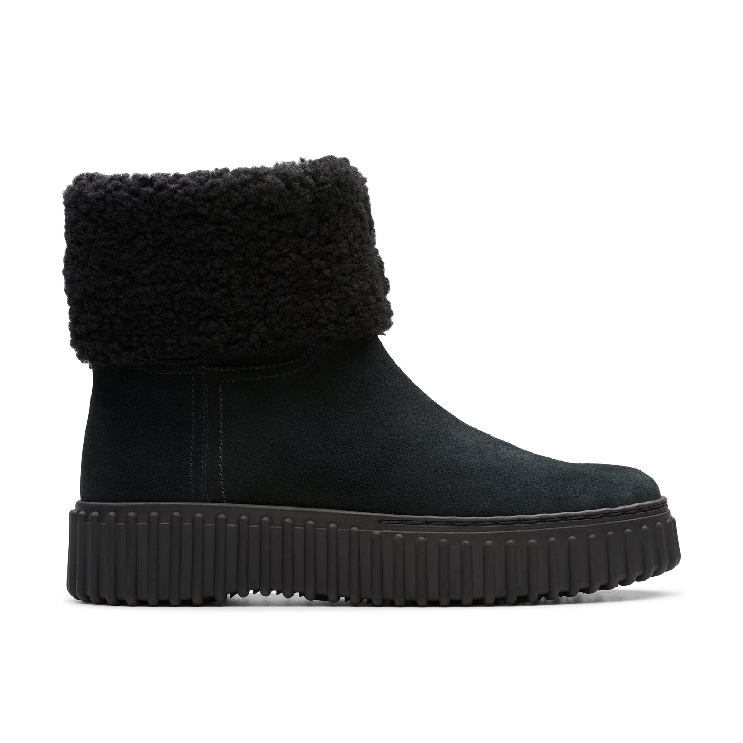 A black suede boot with a fluffy black cuff and thick black sole.