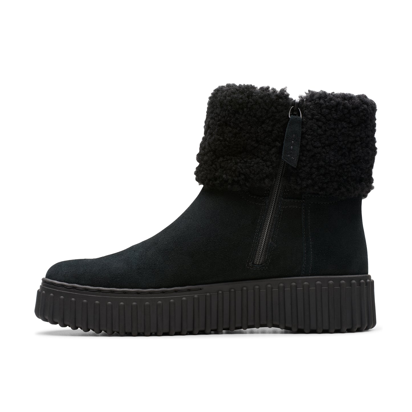 Black suede boot with fluffy wool cuff and lug sole.