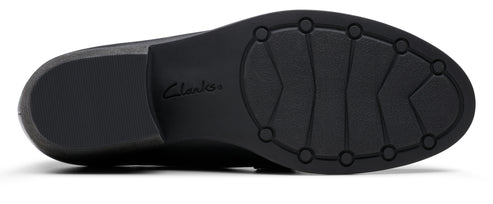 The outsole of a black shoe with the word 'Clarks' etched in the center.