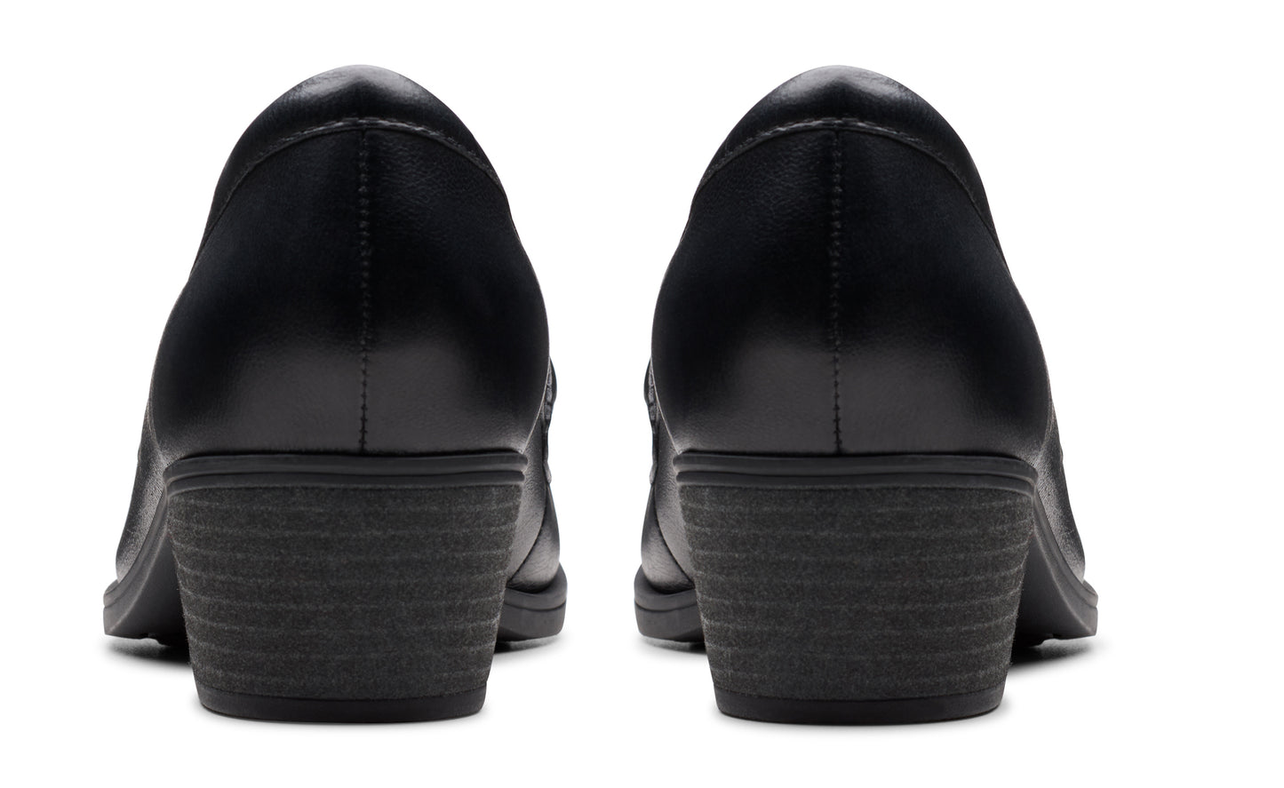 Pair of black leather dress shoes, rear view.