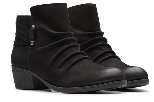 Black ankle boots with gathered front, buckled strap and block heel.