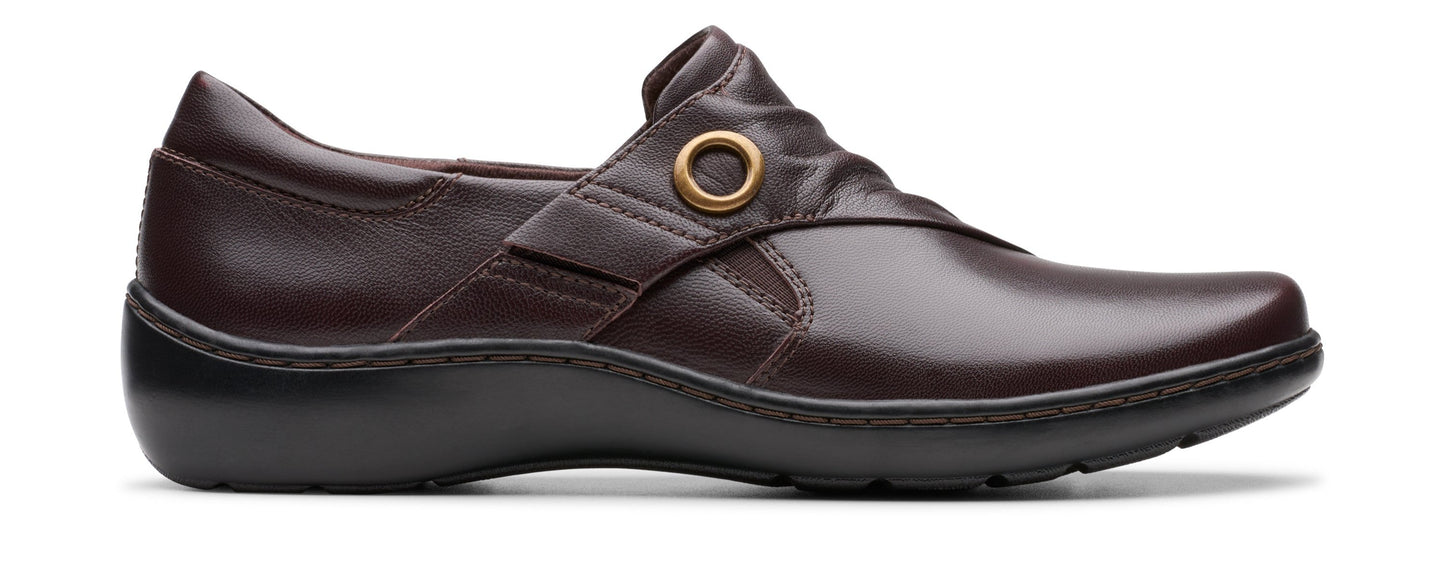 Dark brown leather shoe with a round gold buckle accent.