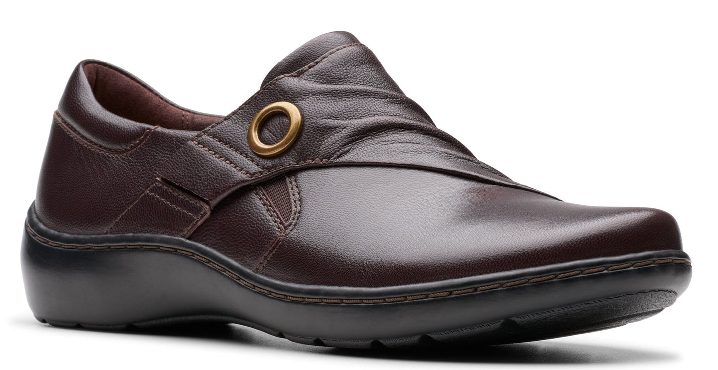 Burgundy leather slip-on shoe with gold ring accent.