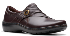Burgundy leather slip-on shoe with gold ring accent.