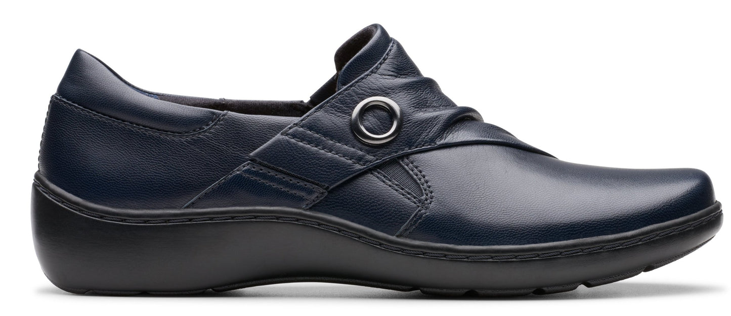Navy blue leather slip-on shoe with a round buckle detail.
