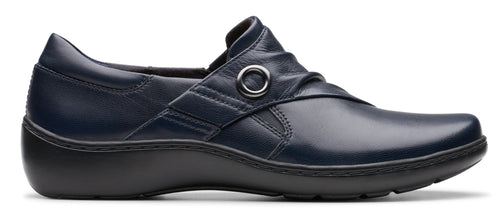 Navy blue leather slip-on shoe with a round buckle detail.