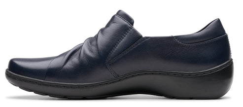 A navy blue leather slip-on shoe with a black sole.