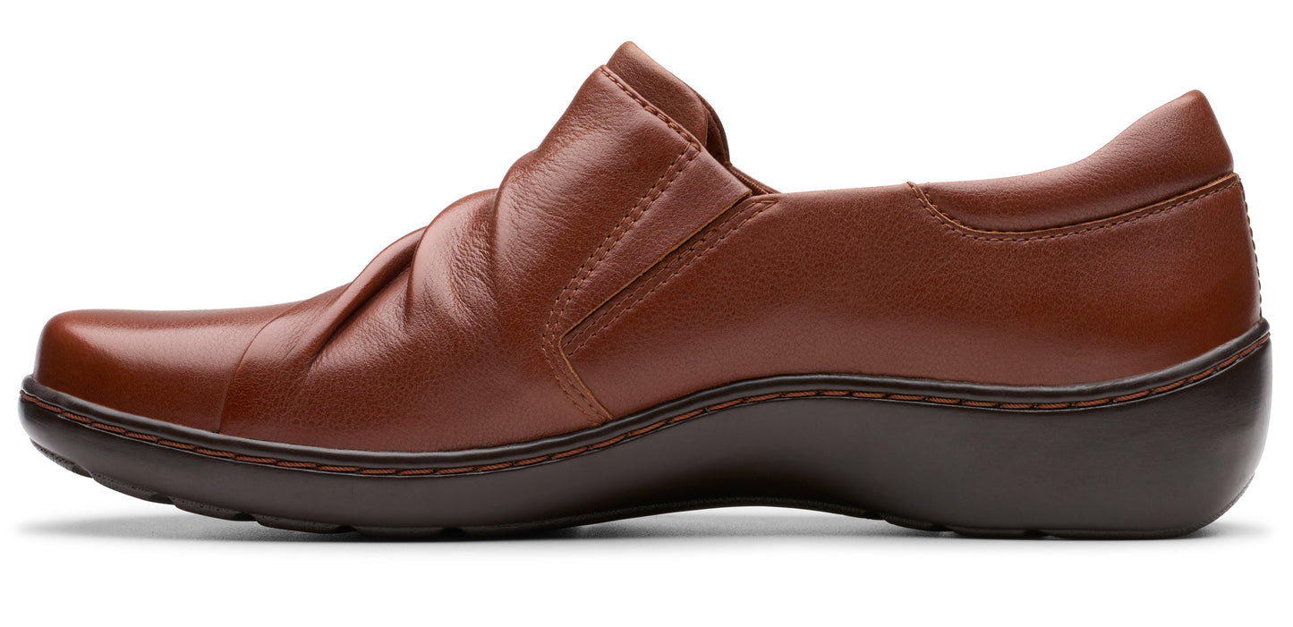 Brown leather slip-on shoe with a low heel and ruched upper.