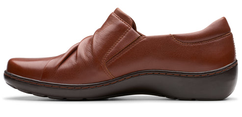 Brown leather slip-on shoe with a low heel and ruched upper.