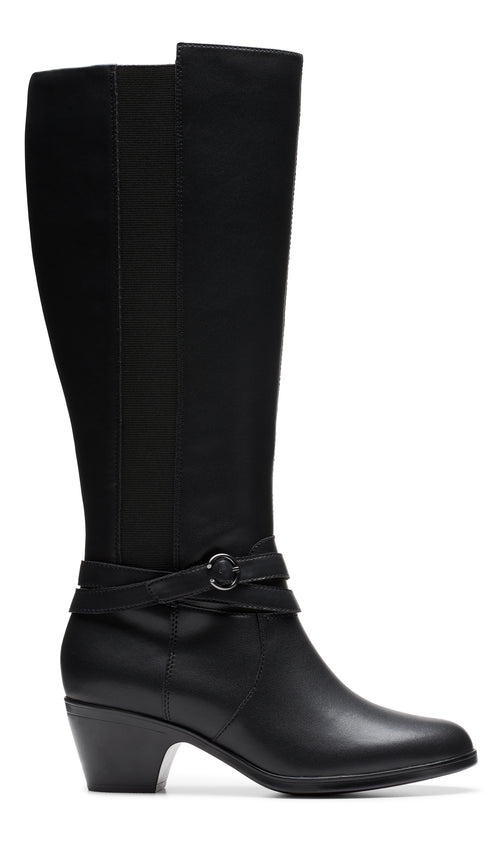 Knee-high black leather boot with a decorative strap and buckle.