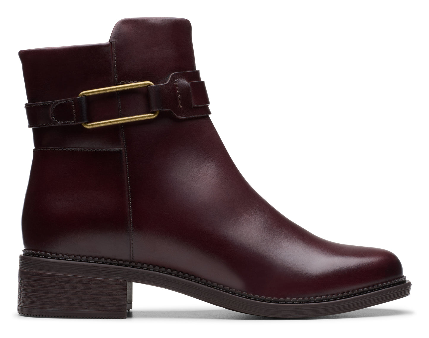 Burgundy ankle boot with a low block heel and a decorative gold buckle.