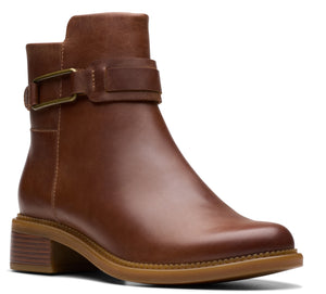 Brown leather ankle boot with block heel and buckle strap.