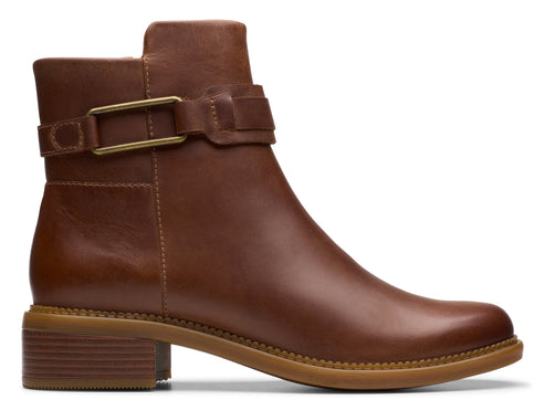 Leather ankle boot with a block heel and buckle strap.
