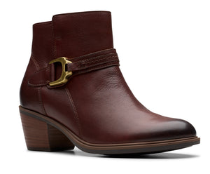 Brown leather ankle boot with gold buckle and block heel.