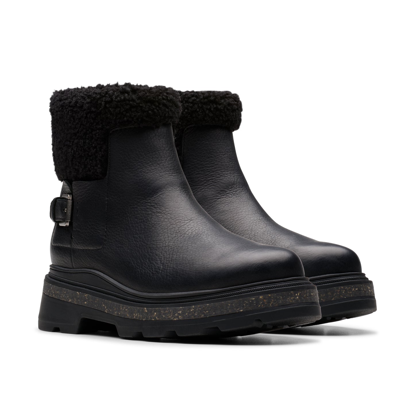 Pair of black ankle boots with furry trim.