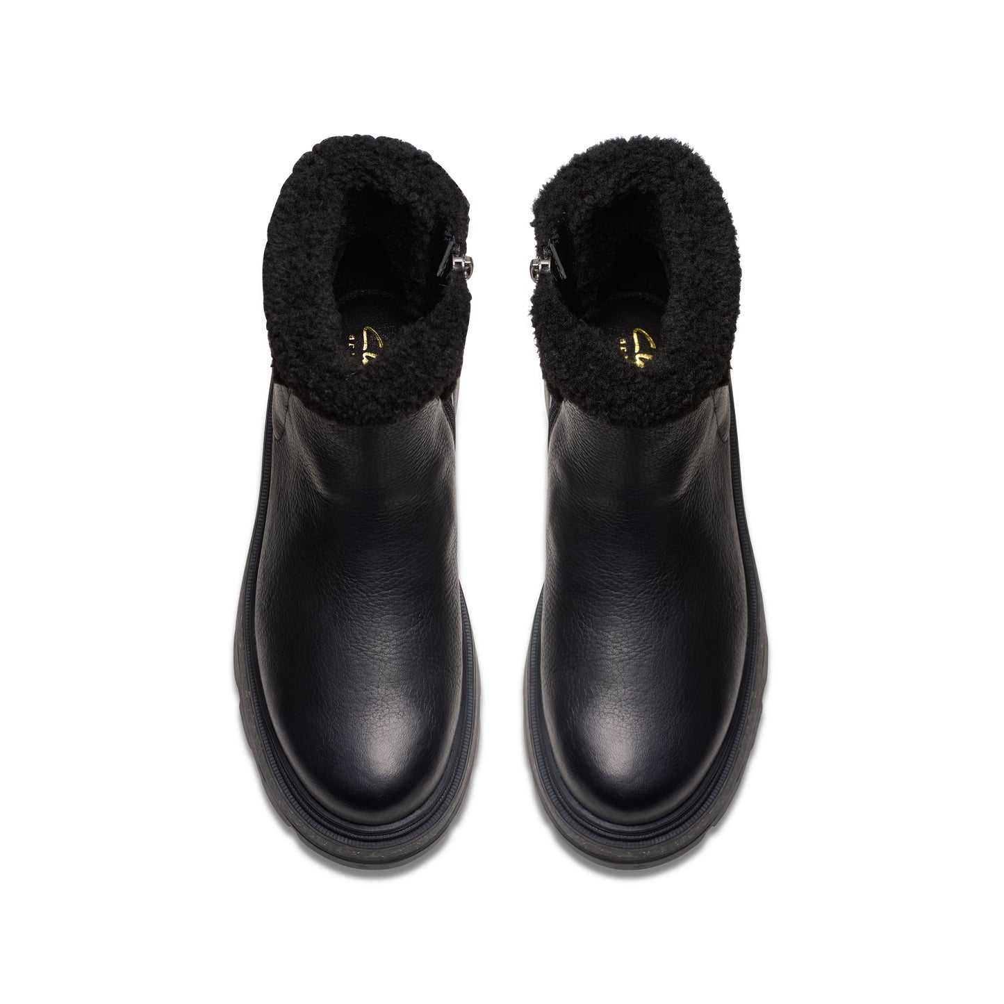 Two black leather ankle boots with faux fur trim.