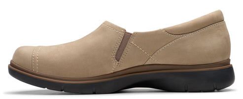 Beige slip-on shoe with black sole.
