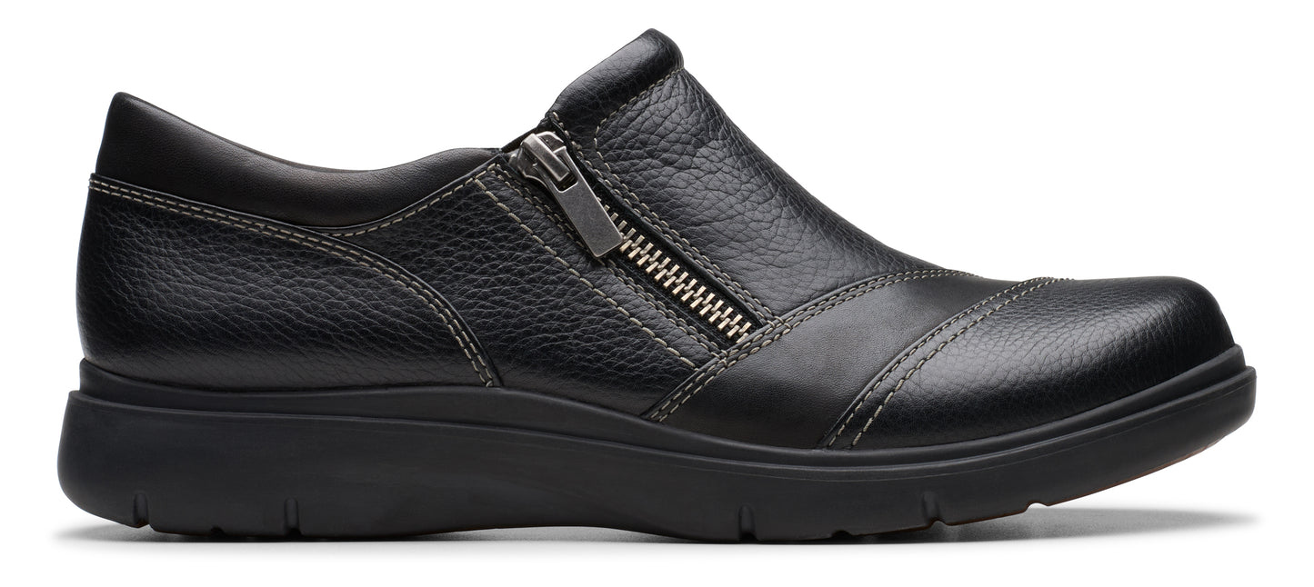 A black leather slip-on shoe with a side zipper.
