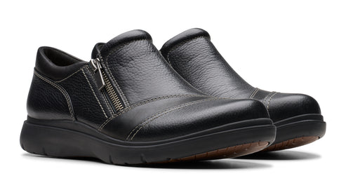 Pair of black leather slip-on shoes with side zipper.