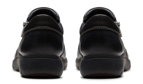 Pair of black leather clogs, rear view.
