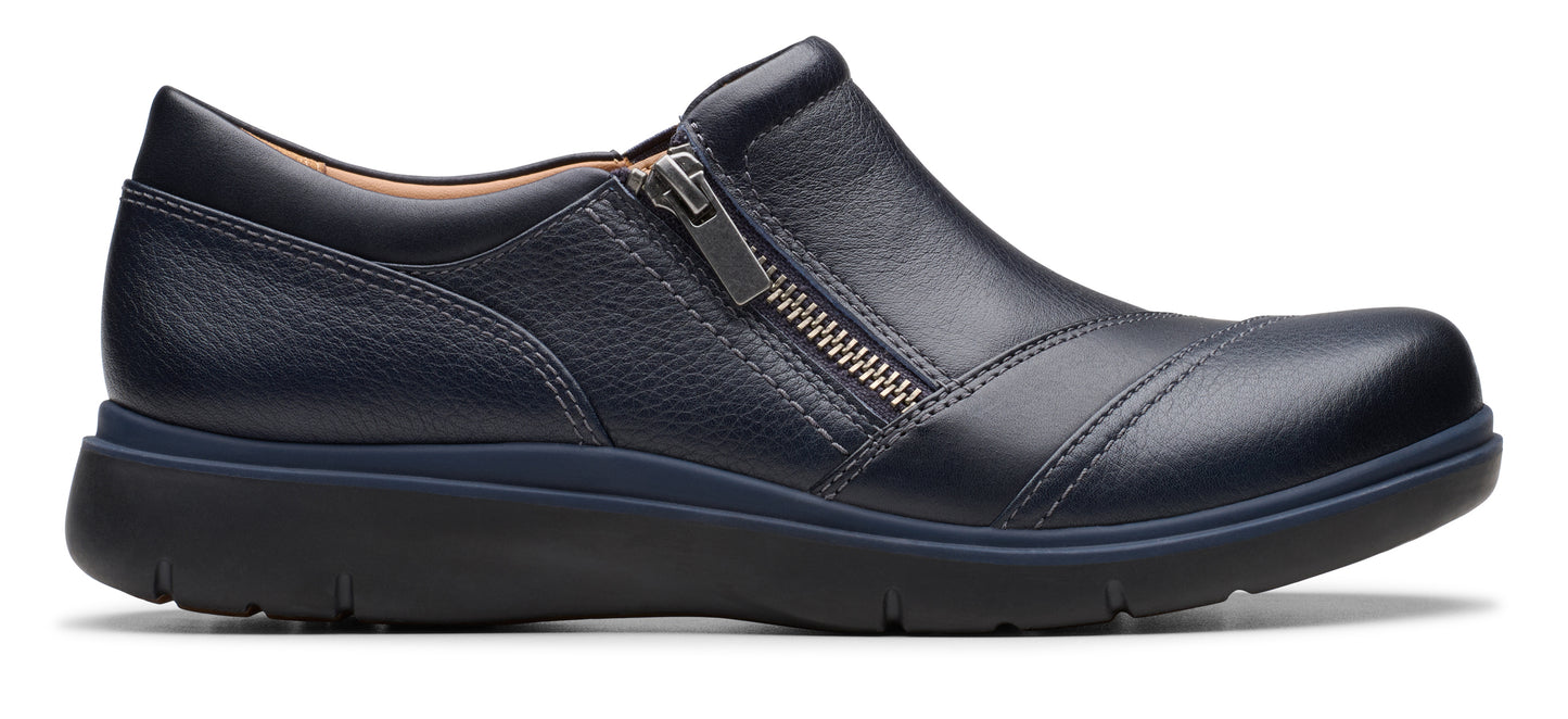 A navy blue leather slip-on shoe with a zipper on the side.