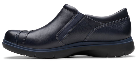 Navy slip-on shoe with low heel.