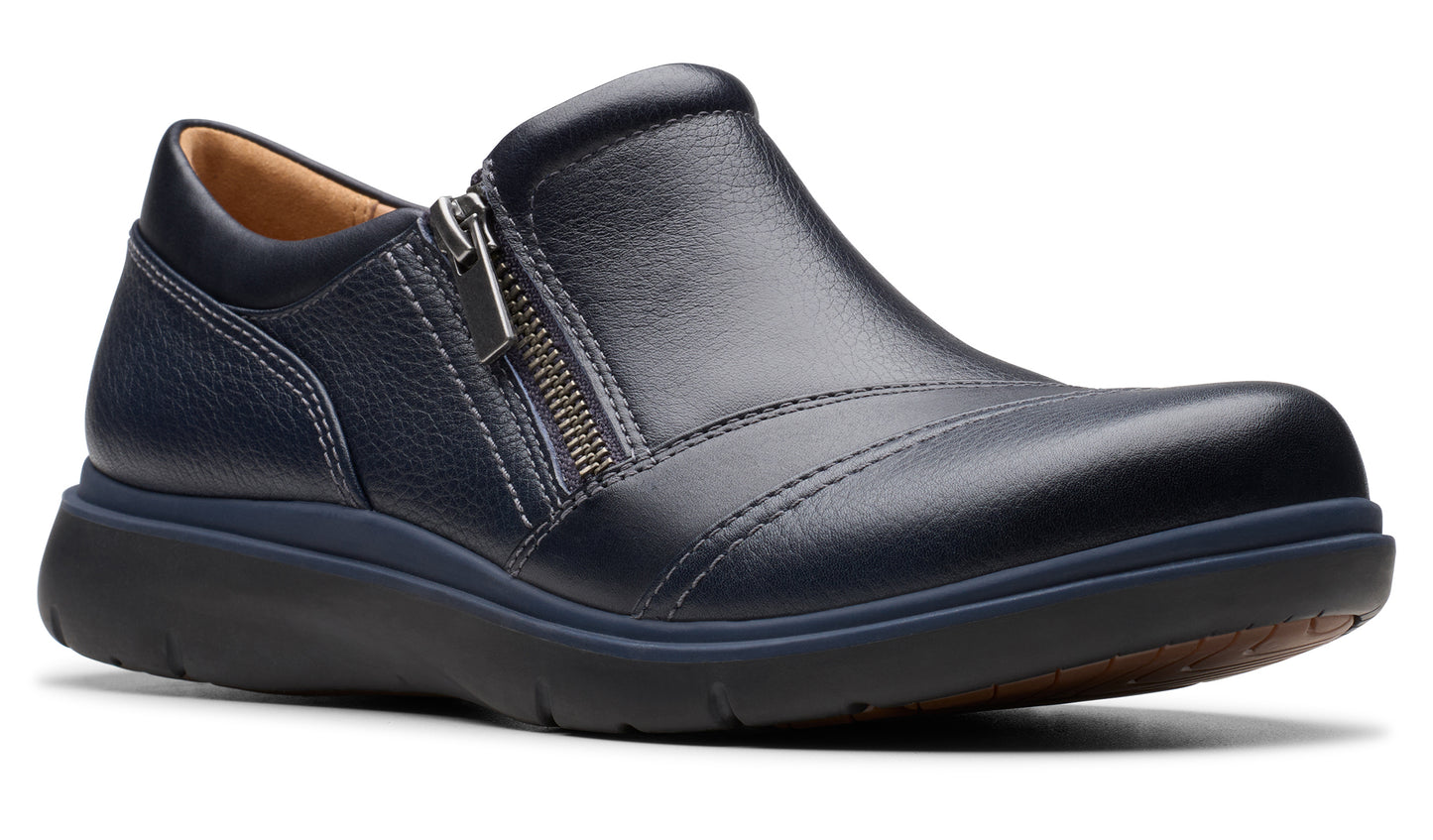 A navy blue leather slip-on shoe with a side zipper and a thick, dark sole.