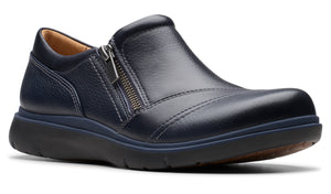 A navy blue leather slip-on shoe with a side zipper and a thick, dark sole.