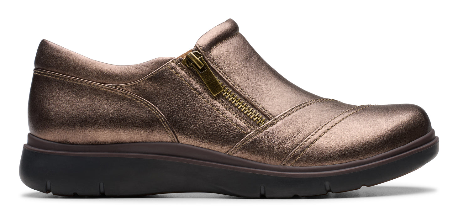 A bronze-colored slip-on shoe with a side zipper.