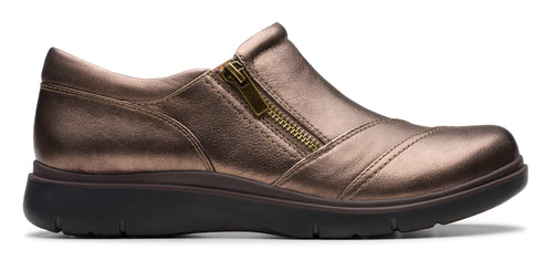 A bronze-colored slip-on shoe with a side zipper.
