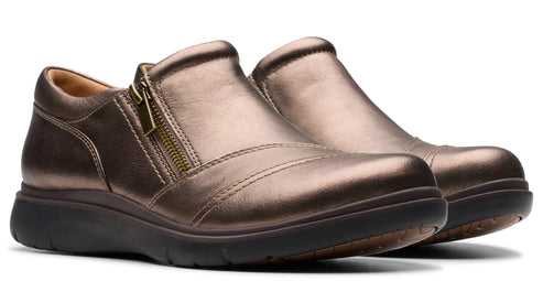 Pair of bronze leather slip-on shoes with zippers