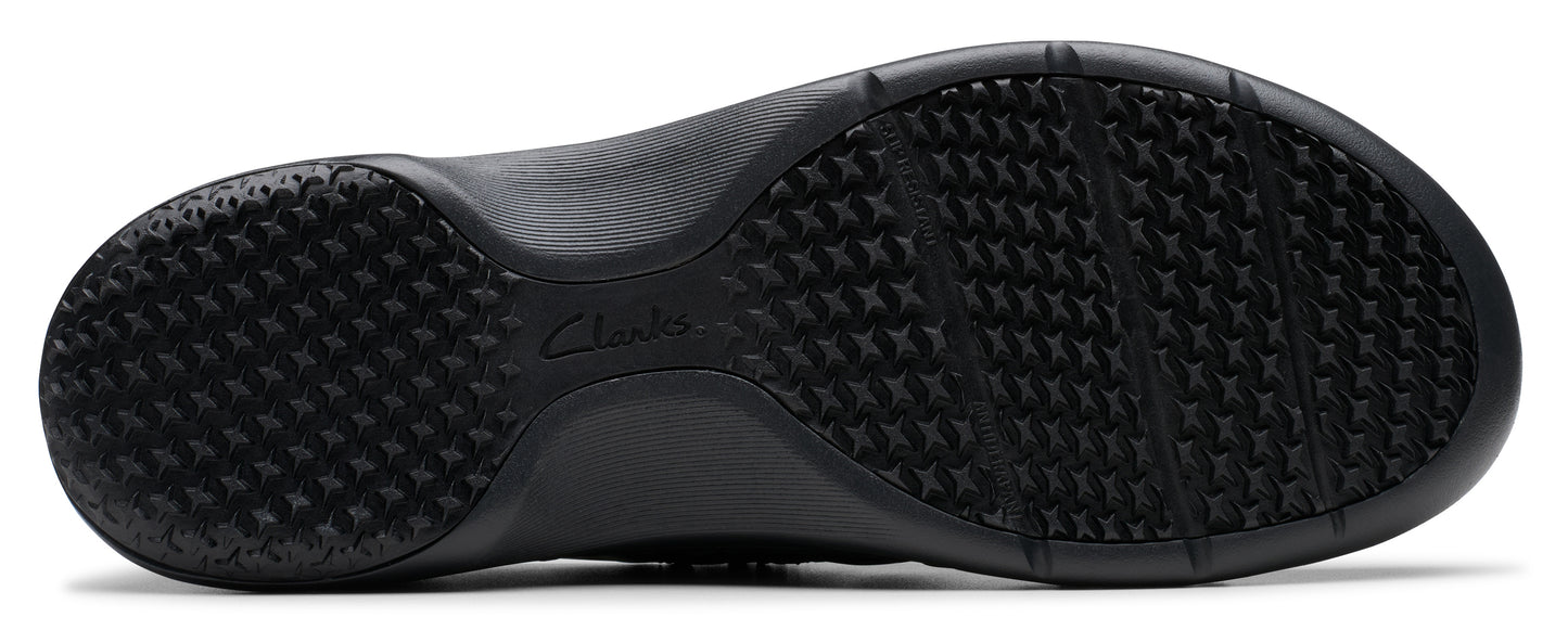 A black shoe sole with a textured, non-slip surface.