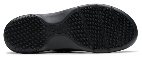 A black shoe sole with a textured, non-slip surface.