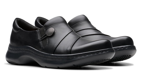 Pair of black leather slip-on shoes with decorative button.